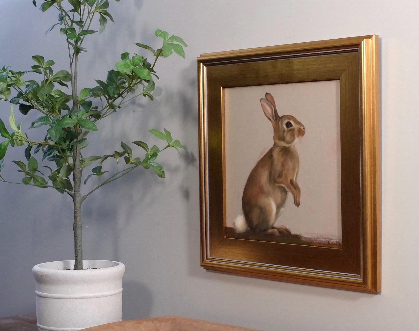 Jax bunny painting in a gold plein air frame