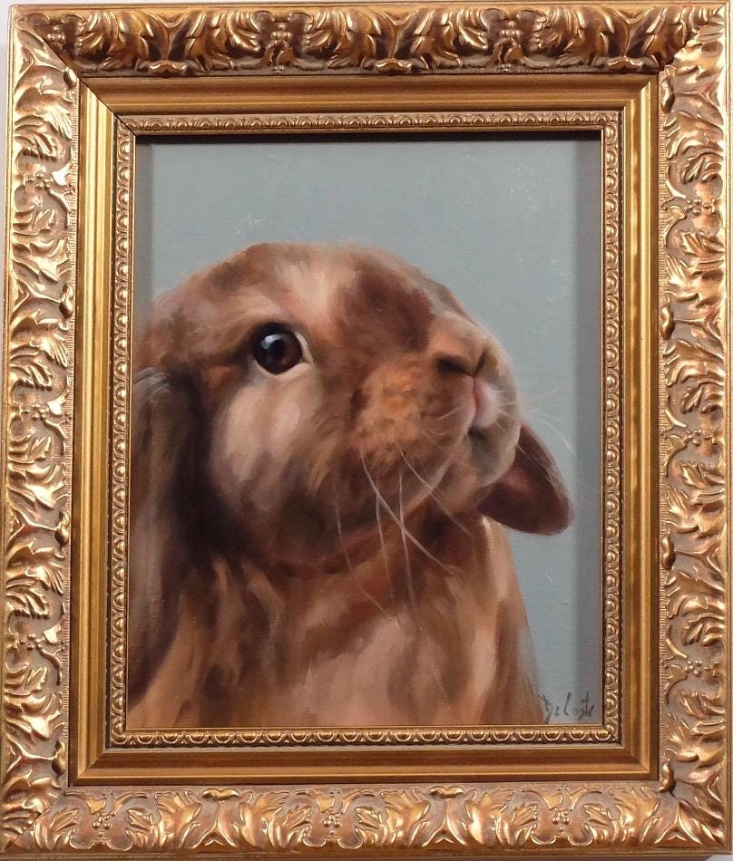 Coco bunny with the blue background in ornate gold frame